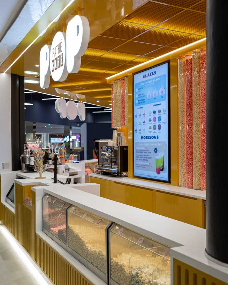 fay-architectes-pathe-cinema-cafe-pop-senart-comptoir cinéma architecture intérieure jaune