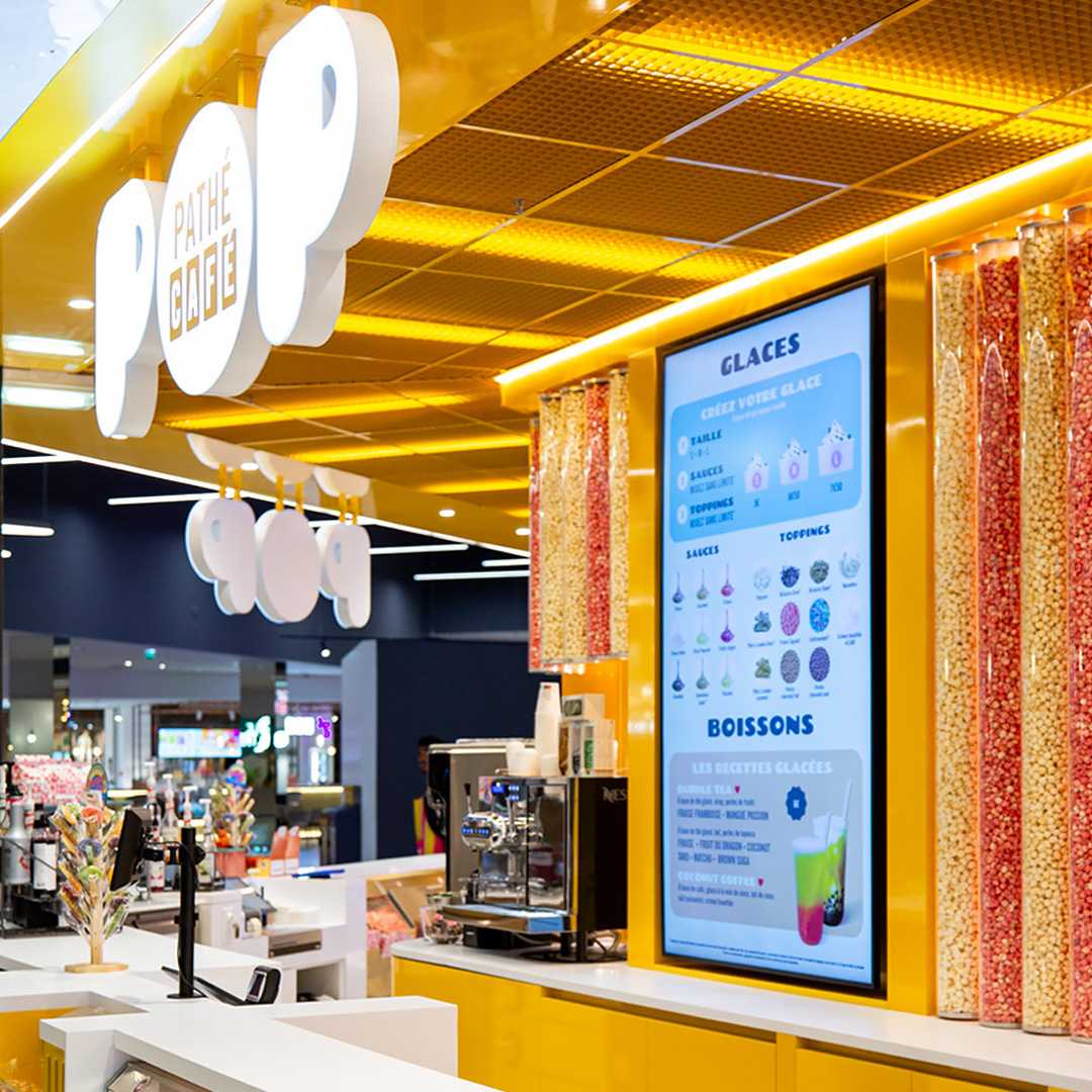 fay-architectes-pathe-cinema-cafe-pop-senart-comptoir cinéma architecture intérieure jaune